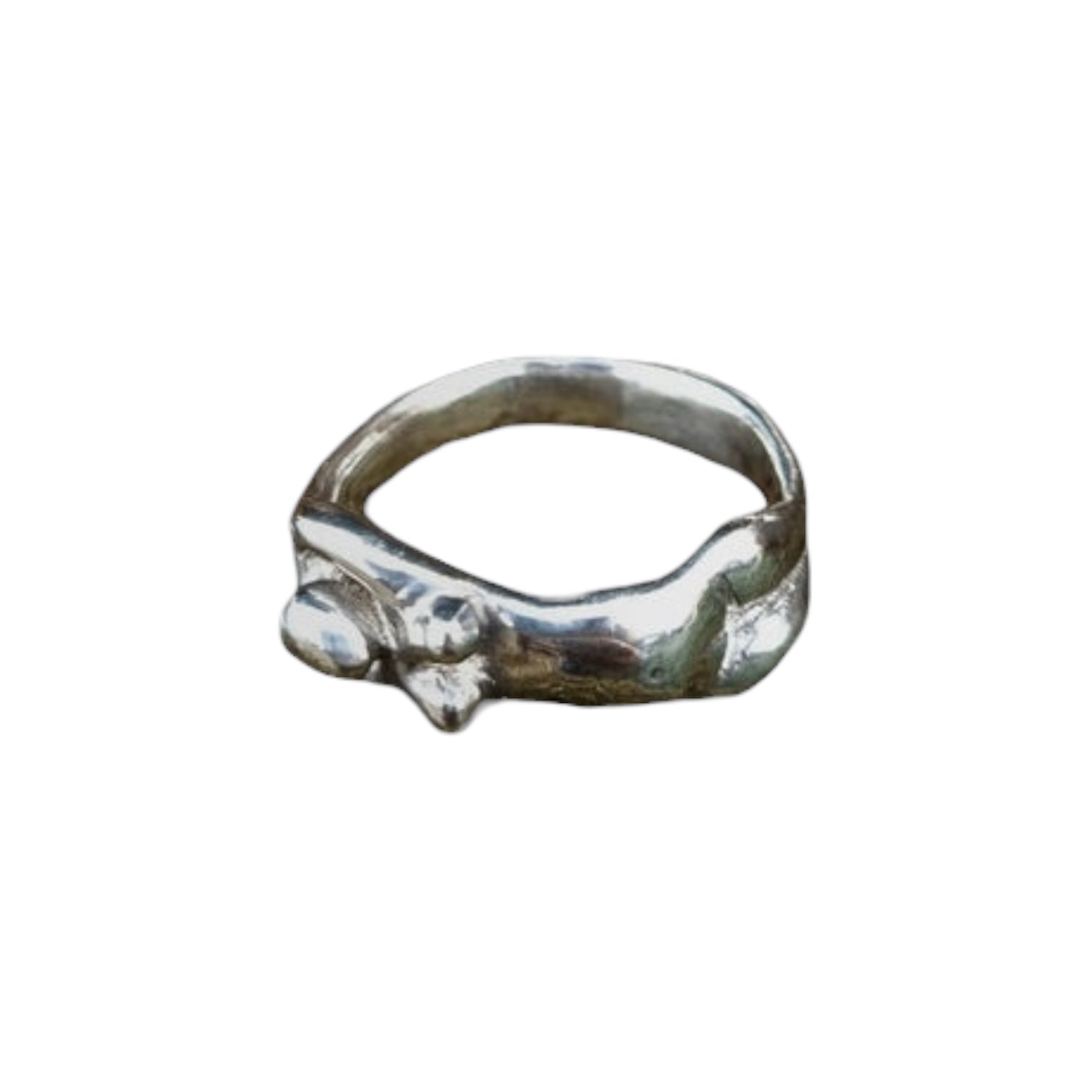 nude female body ring with boobs against white background 